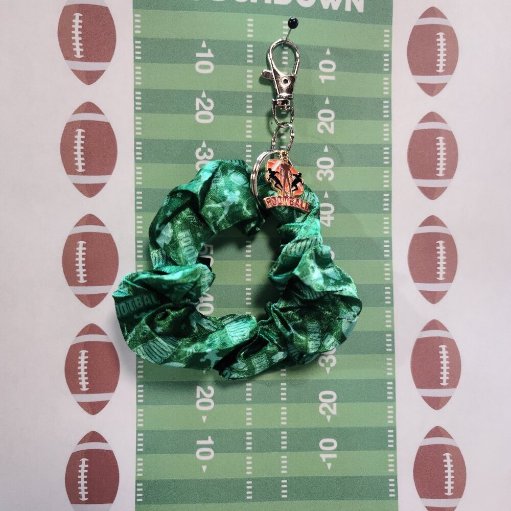 Football Themed Wristlet Keyring with a Football related charm attached !!